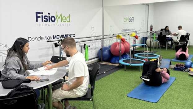 Physiotherapy Center with Patients Engaged in Rehabilitation Exercises